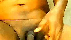 This athletic ebony shemale with a small cock strips down at home, teasing in see-through clothes before riding a dildo.