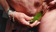 Granny fucks hairy pussy with cucumber deep