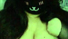 a goth girl teases her massive tits live on webcam.