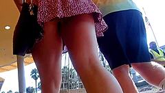 A guy captures public upskirt footage in slow motion outdoors under her skirt.