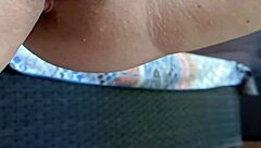 Mature squats spreads legs wide outdoors