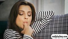 a sexy brunette babe fingers her shaved pussy moaning hard in solo play on the bed