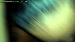 doctor examines patient closely in hospital room setting