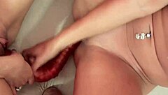 two girls play with sex toys in a steamy girl-on-girl session