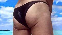 sexy bikini beach handjob with waves crashing as i stroke cock hard... oops spilled!!