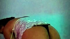 Latina amateur slips dildo in while shaking big natural tits like a slut at home.