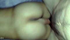 Thick milf ass cheeks spread wide for deep anal pounding on the bed.