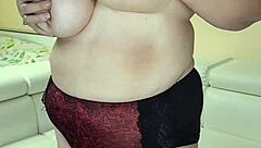 Thick busty granny strips naked showing off her huge tits and hairy pussy