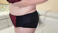 Thick busty granny strips naked showing off her huge tits and hairy pussy