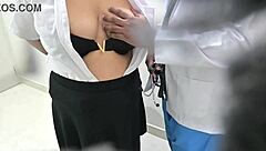 doctor examines patient closely in hospital room