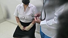doctor examines patient closely in hospital room