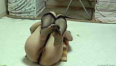 booty babe teases cameltoe in fishnets and thong