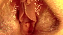 Blonde mature aunt spreads her huge shaved pussy lips wide open