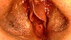 Blonde mature aunt spreads her huge shaved pussy lips wide open