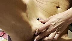 Watch this sexy blonde wife oil up for big dildos solo play