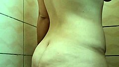 innocent brunette shaves legs and armpits in steamy shower solo