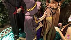 Blonde sorceress in stockings rides monster cock amid orgy chaos.