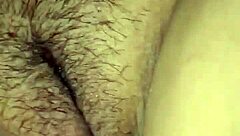 She plays with her smooth pussy in intimate close-up scene