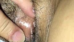 She plays with her smooth pussy in intimate close-up scene