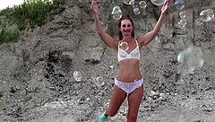 Mature Crossdresser Covers Transparent Bikini in Soap Bubbles