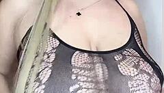 milf caresses curves in see-through outfit softly
