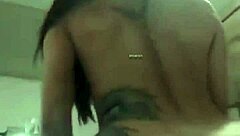 She rides dildo on webcam showing big ass and tits tattooed