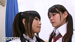 Two Japanese school teens share double dildo strapon