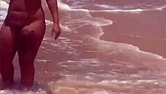 young african exhibitionist strips fully nude on crowded beach