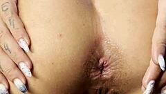 close up toy play leads to anal insertion and squirting