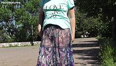 i'm a hairy mature flashing my pussy thru see-thru dress outside