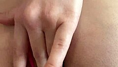 Pretty girl spreads hairy pussy close-up through thong panties