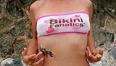 Brunette babe chills bikini flashing public beach