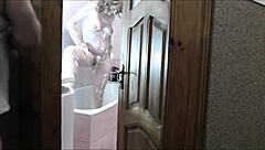 Naked blonde milf showers as roommate jerks cock watching cumshot