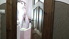 Naked blonde milf showers as roommate jerks cock watching cumshot