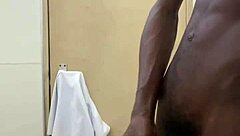 Monster black cock busts huge nut in public toilet!