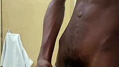 Monster black cock busts huge nut in public toilet!