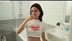 brunette steps under the warm shower, fingers her shaved wet pussy till she cums