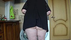 a hidden cam sneaks under this mature blonde wife's skirt catching her fat juicy hairy pussy up close