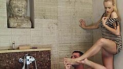 Blonde gives footjob then bends for deep sink fuck and facial