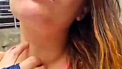 a redhead married woman strolls through the streets of sao paulo in a cage