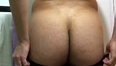 A big ass woman named Nafida poses in a fetish showcase video