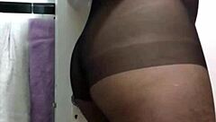 A big ass woman named Nafida poses in a fetish showcase video