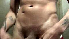 check out this tattooed amateur stud flashing his huge cock for the camera in solo tease