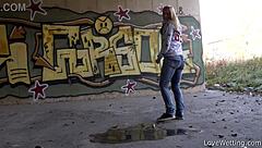 violeta stands proud by her outdoor puddle in public