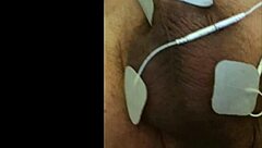 guy tries fisting with electrodi gadget close up