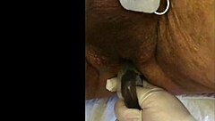 guy tries fisting with electrodi gadget close up