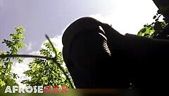 Naughty pantyhose babe tempts in the lush garden—ready to rip them off?