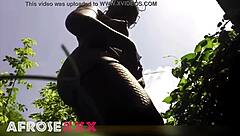 Naughty pantyhose babe tempts in the lush garden—ready to rip them off?