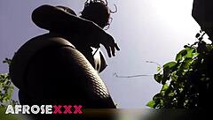 Naughty pantyhose babe tempts in the lush garden—ready to rip them off?