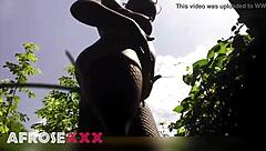 Naughty pantyhose babe tempts in the lush garden—ready to rip them off?